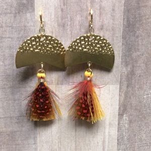 Custom earrings with red and yellow feathered fringe